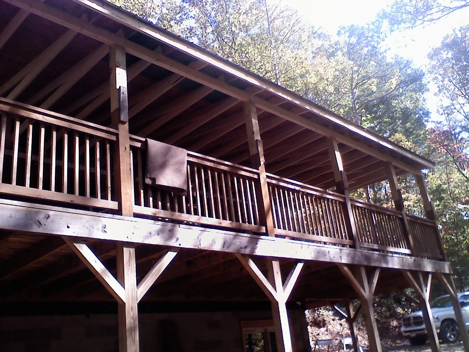 Timber framing under a new elevated porch and deck — Roof Leak Repair in Island Lake by Roofing Brothers